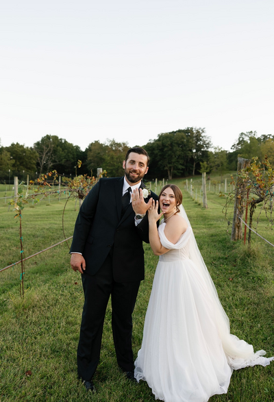 Bride and groom pose at Sassafras Vineyards wedding venue in Arkansas