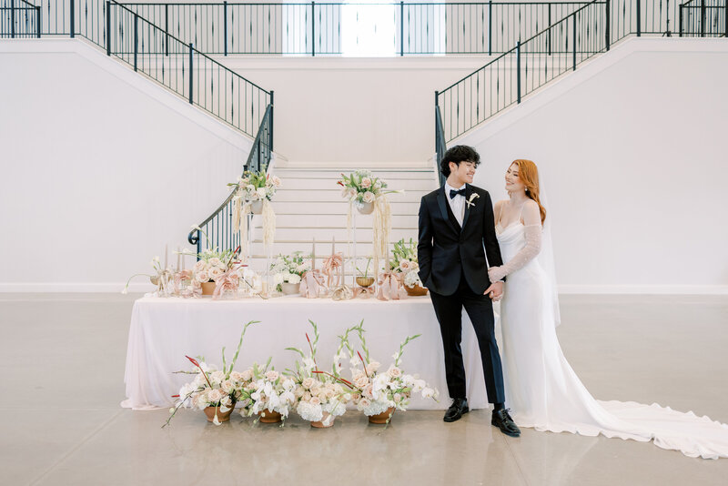 Newlyweds pose at The Grand at Willow Springs wedding reception