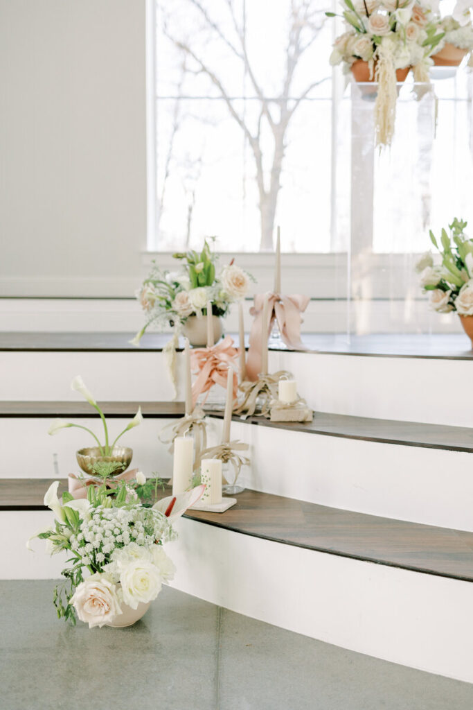 Wedding florals and candles at ceremony