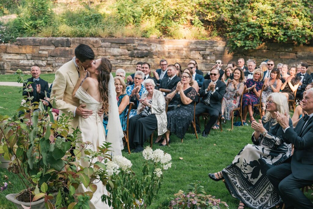 Bride and groom kiss at Crystal Bridges wedding ceremony