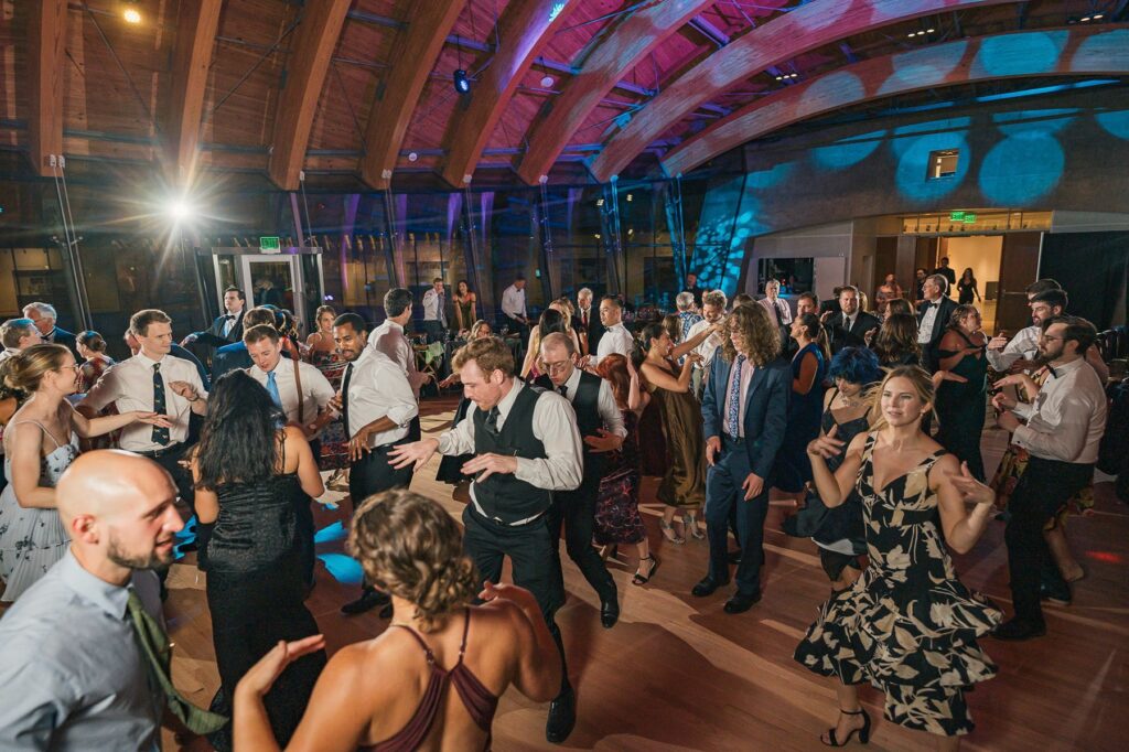 Guests party on the dance floor at wedding