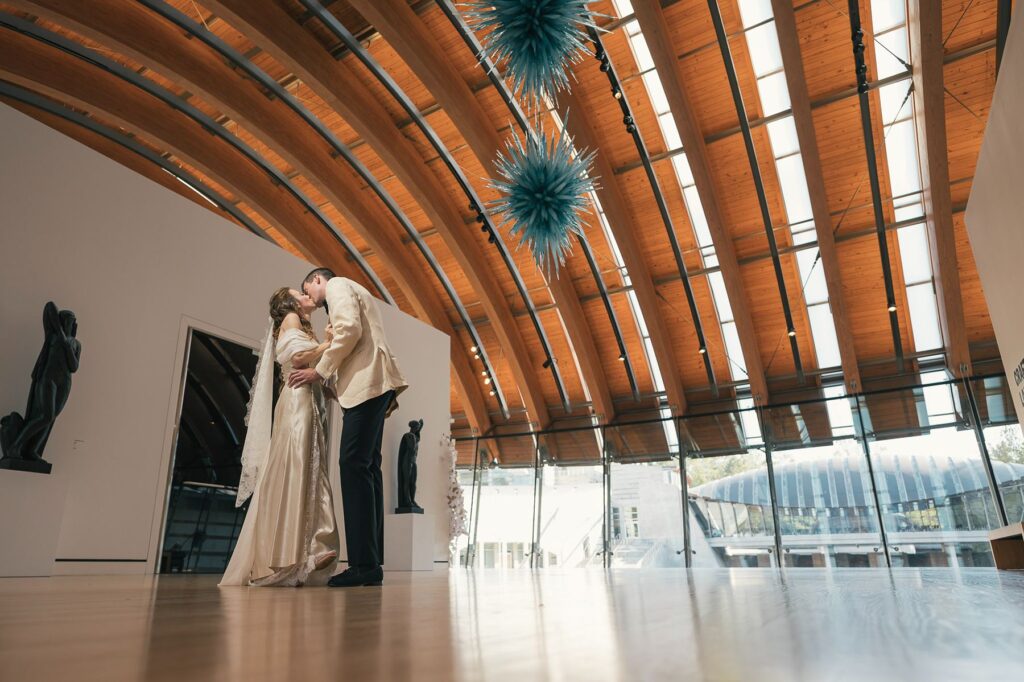 Bride and groom kiss at Crystal Bridges wedding