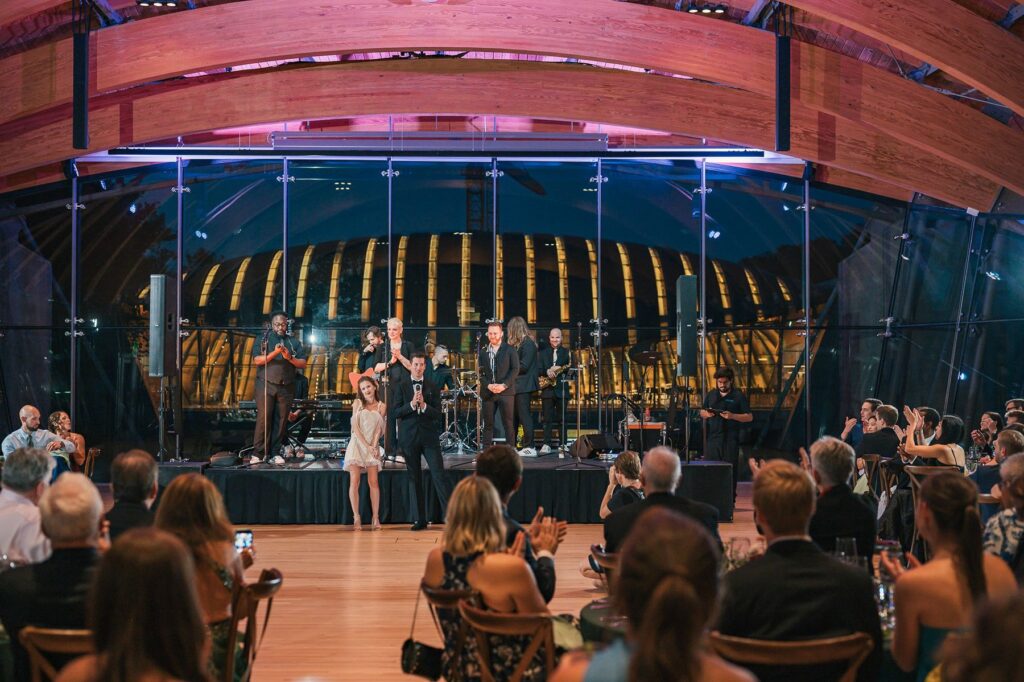 Bride and groom give toast at wedding reception